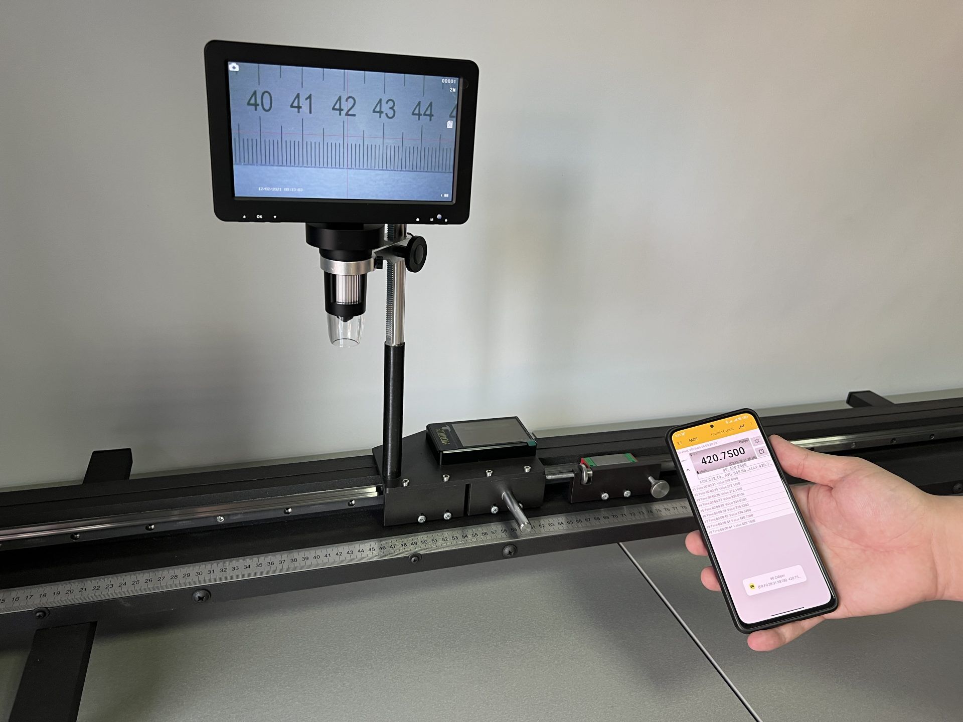 dokumentenscanner, messschieber, digitaler messmonitor, telefon mit app, präzisionsmessung