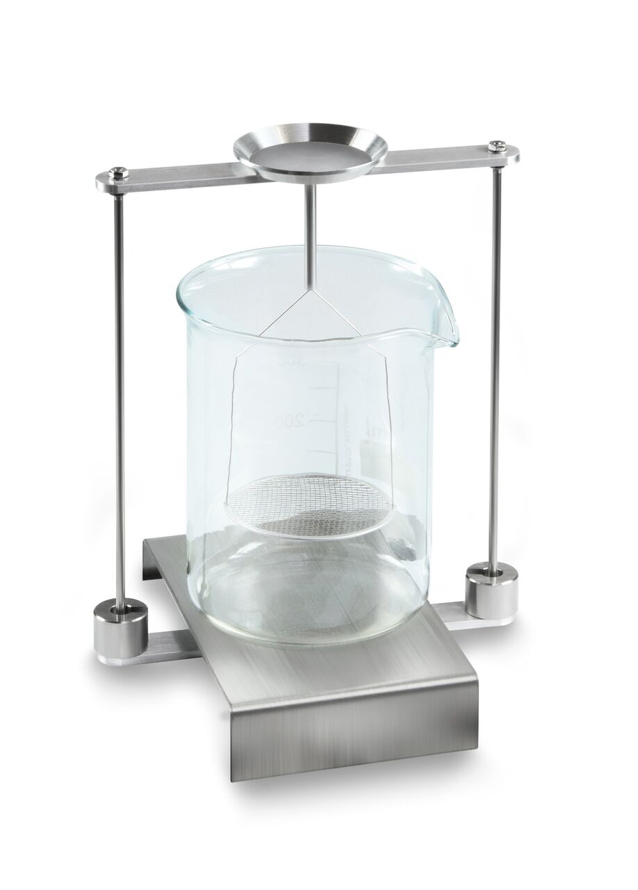 Dichtset auf weißem Hintergrund. Das Set steht auf einer Basis aus Edelstahl. Darauf steht ein Reagenzglas aus Glas. Eine Konstruktion hält eine Edelstahl-Schale hoch. Von dieser Schale hängt eine zweite Schale in das Reagenzglas.